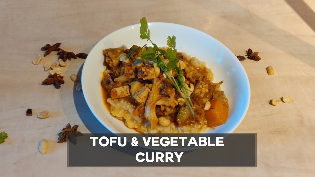 Tofu and vegetable curry served with red lentils and brown rice